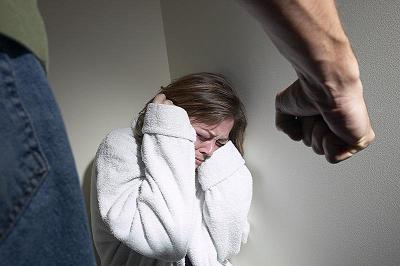 Man with Clenched Fist in Front of Woman - About to Commit Domestic Violence