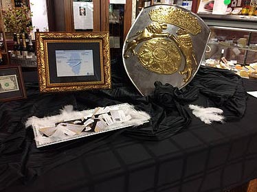 Armored Angel Sword on Table Showing Domestic Violence Abuse Prevention Setup