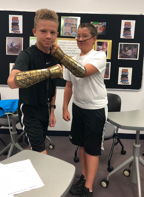 Kids displaying armor gold cuffs