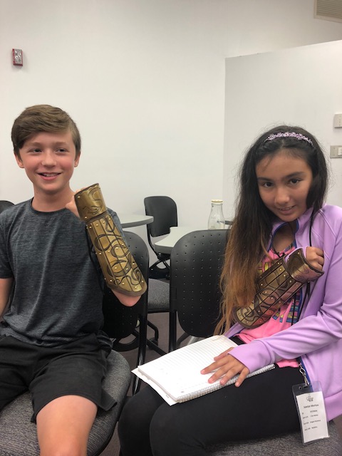 Two Children With Armored Angel Fund Arm Band
